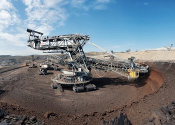 white and black airplane on brown sand during daytime