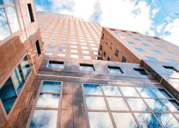 blue and white concrete building under blue sky