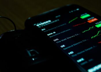 smartphone on brown wooden surface