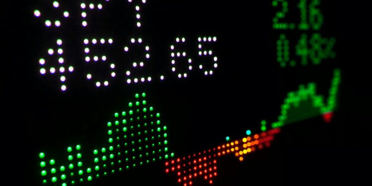 a close up of a clock with different colored numbers