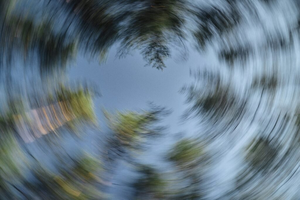Trees and sky blurred with a radial effect.