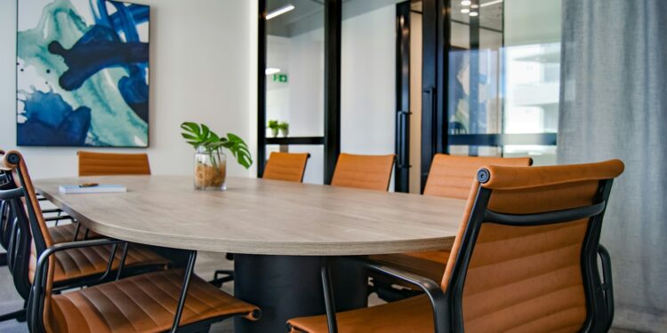 brown wooden 9-piece office table and chairs