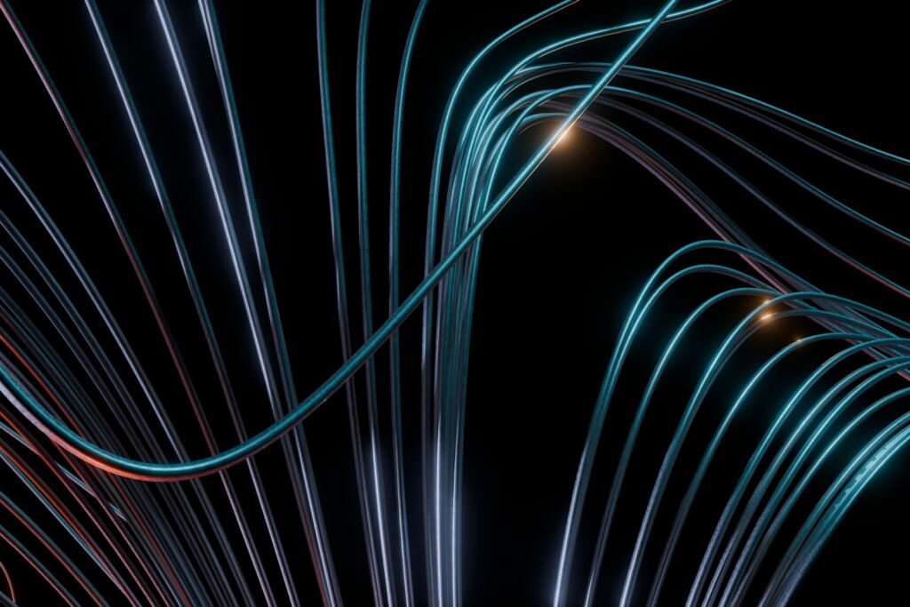 Abstract blue and orange glowing lines on black background