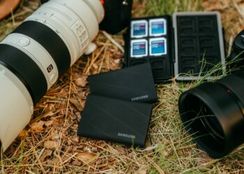 Camera equipment and storage devices on grass