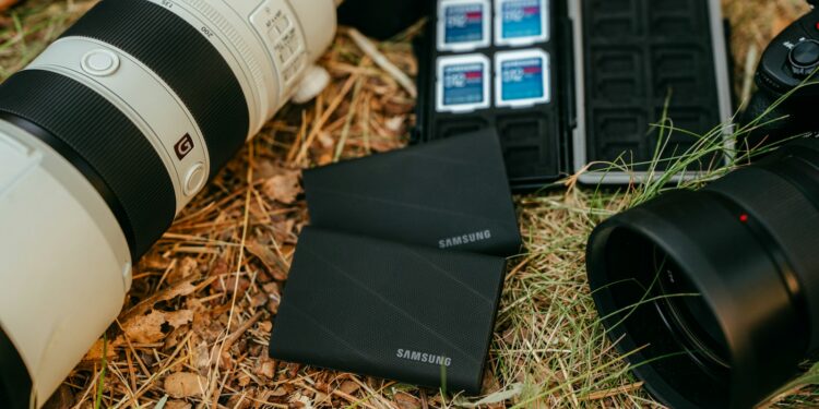 Camera equipment and storage devices on grass