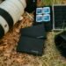 Camera equipment and storage devices on grass