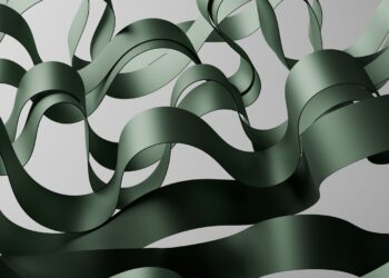 A computer generated image of a wave of green ribbon