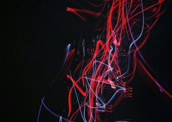 red and blue doodle artwork with black background