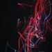 red and blue doodle artwork with black background