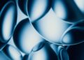 Abstract blue spheres with bright highlights