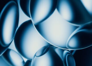 Abstract blue spheres with bright highlights