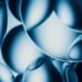 Abstract blue spheres with bright highlights